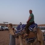 Nick taking a camel ride during our desert safari trip[ in Dubai.