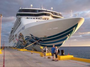 During one of the port stops on the Eastern Caribbean cruise, Roguetrippers pose in front of the Norwegian Spirit before boarding after a great day in Belize 2010.