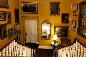 The portrait gallery in the stairwell of Ballyseede Castle gave decorating inspiration for Roguetrippers.