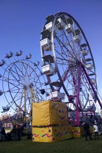 Duo of Ferris wheels at a Local Agricultural Fair - roguetrippers had fun.