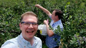 Greg Bellefontaine and Nick Kulnies picking blueberries in Perth County Ontario