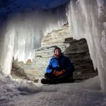 Ice Caves forming around a frozen Waterfall