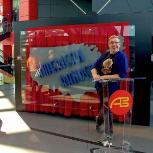 Nick Kulnies doing his best dick clark impersonation at the American Bandstand exhibit
